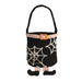 A black felt bucket bag with a white spiderweb pattern, a pink faux-fur belt, and a small orange buckle, shown on a plain white background.