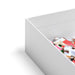 Open white jigsaw puzzle box with colorful pieces visible inside from the Pippi Post Gingerbread Square Christmas puzzle