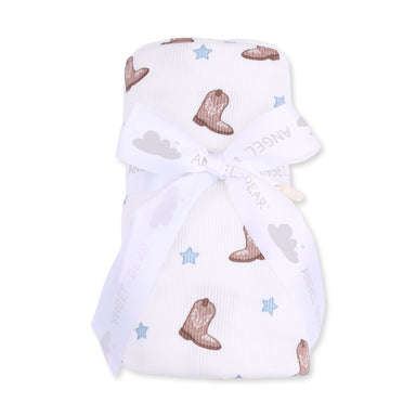 Baby swaddle with cowboy boot and star patterns on a white background