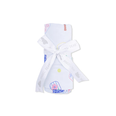 Baby blanket with colorful pickleball patterns and a white ribbon on a white background