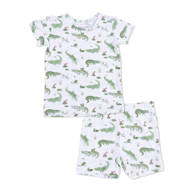 Children's pajama set with alligator pattern on a white background