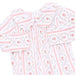 A long-sleeve button-up shirt with a white base, featuring a delicate pink and green floral pattern, vertical pink stripes, and a matching fabric tie at the collar.