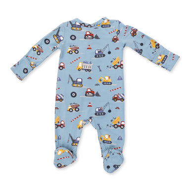 Baby onesie with construction vehicle pattern on a blue background