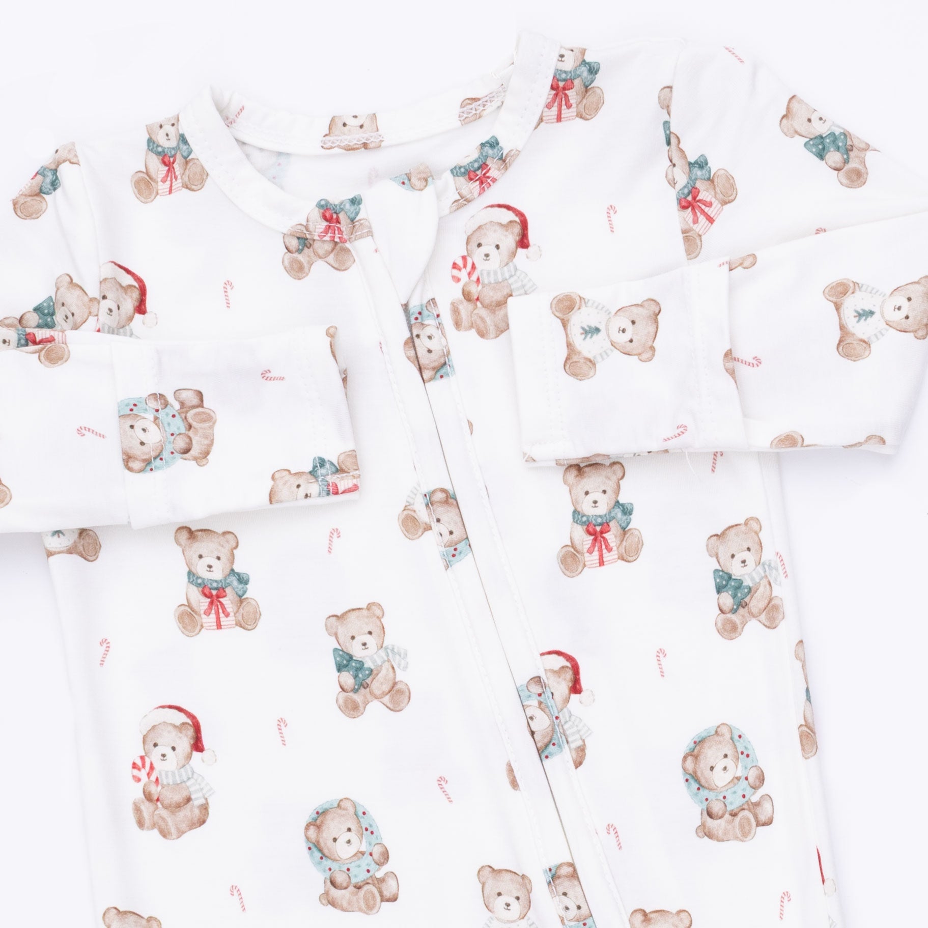 Pattern of teddy bears with Santa hats and scarves on a white background