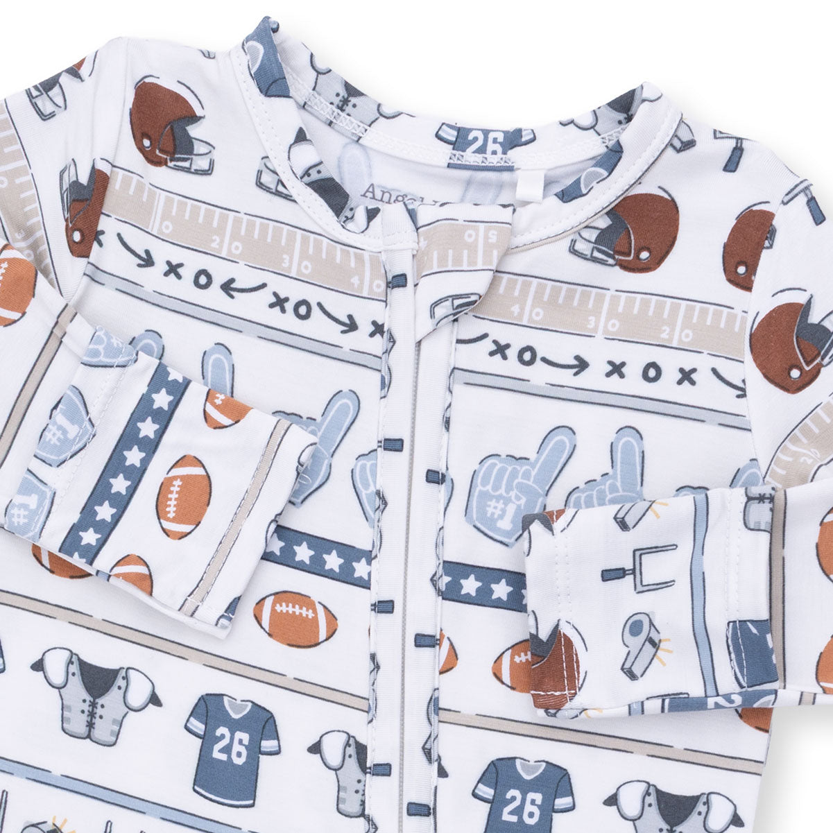 Children's pajamas with sports-themed design on a white background