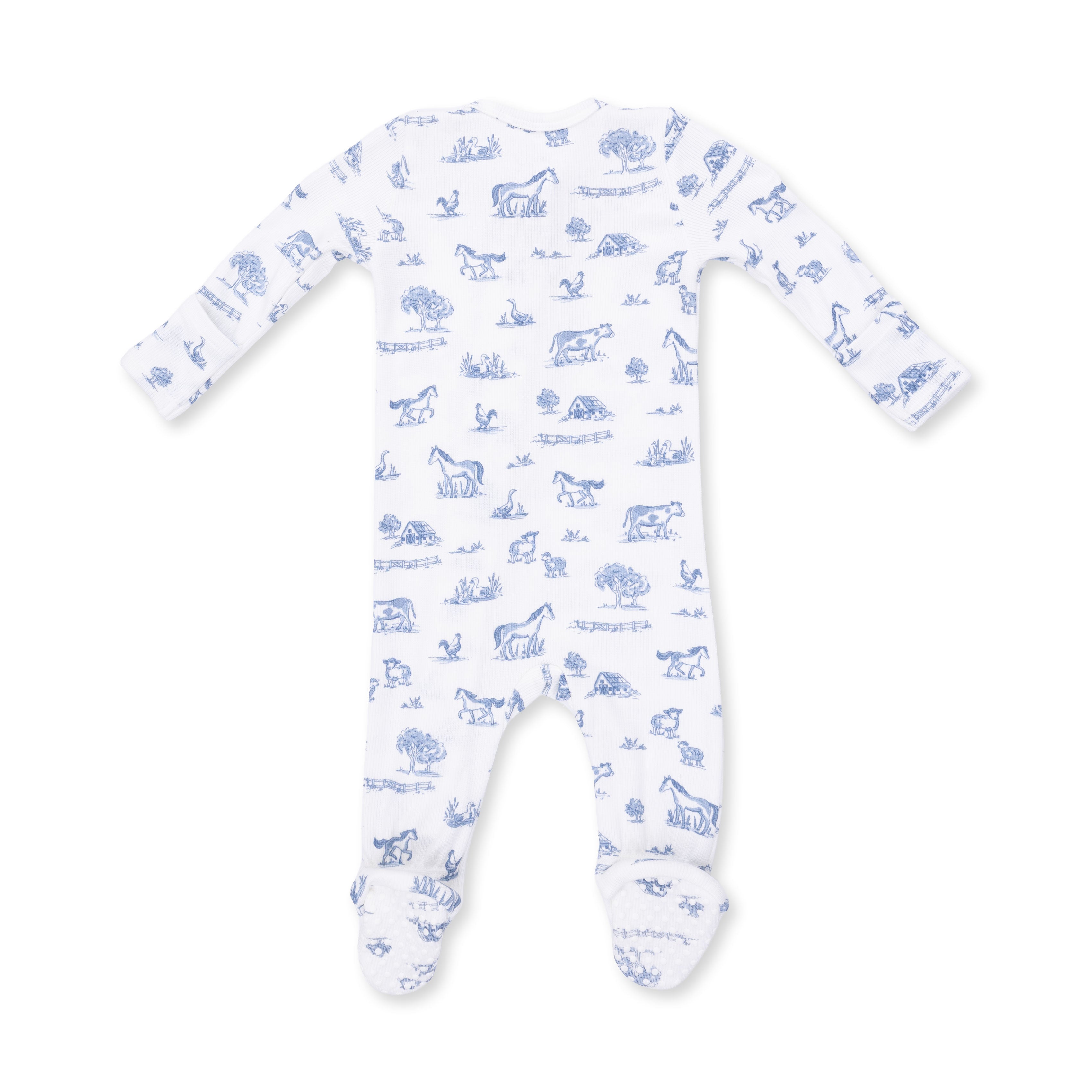 White baby onesie with blue animal prints on a white background