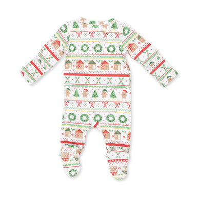 A baby footed sleeper with long sleeves and a festive Christmas pattern featuring green wreaths, gingerbread houses, candy canes, and snowman motifs on a white background.