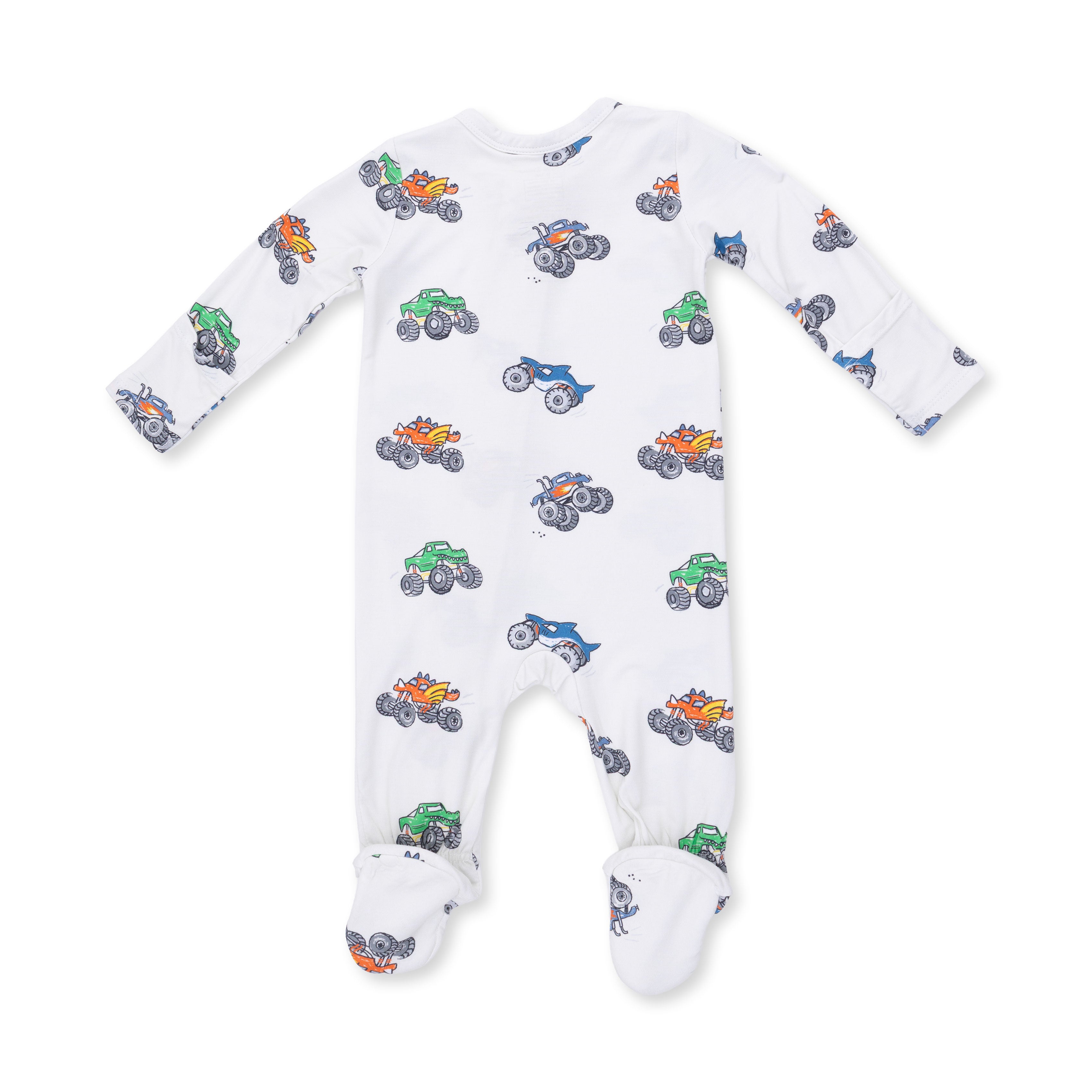 White baby onesie with colorful monster truck pattern on a white background