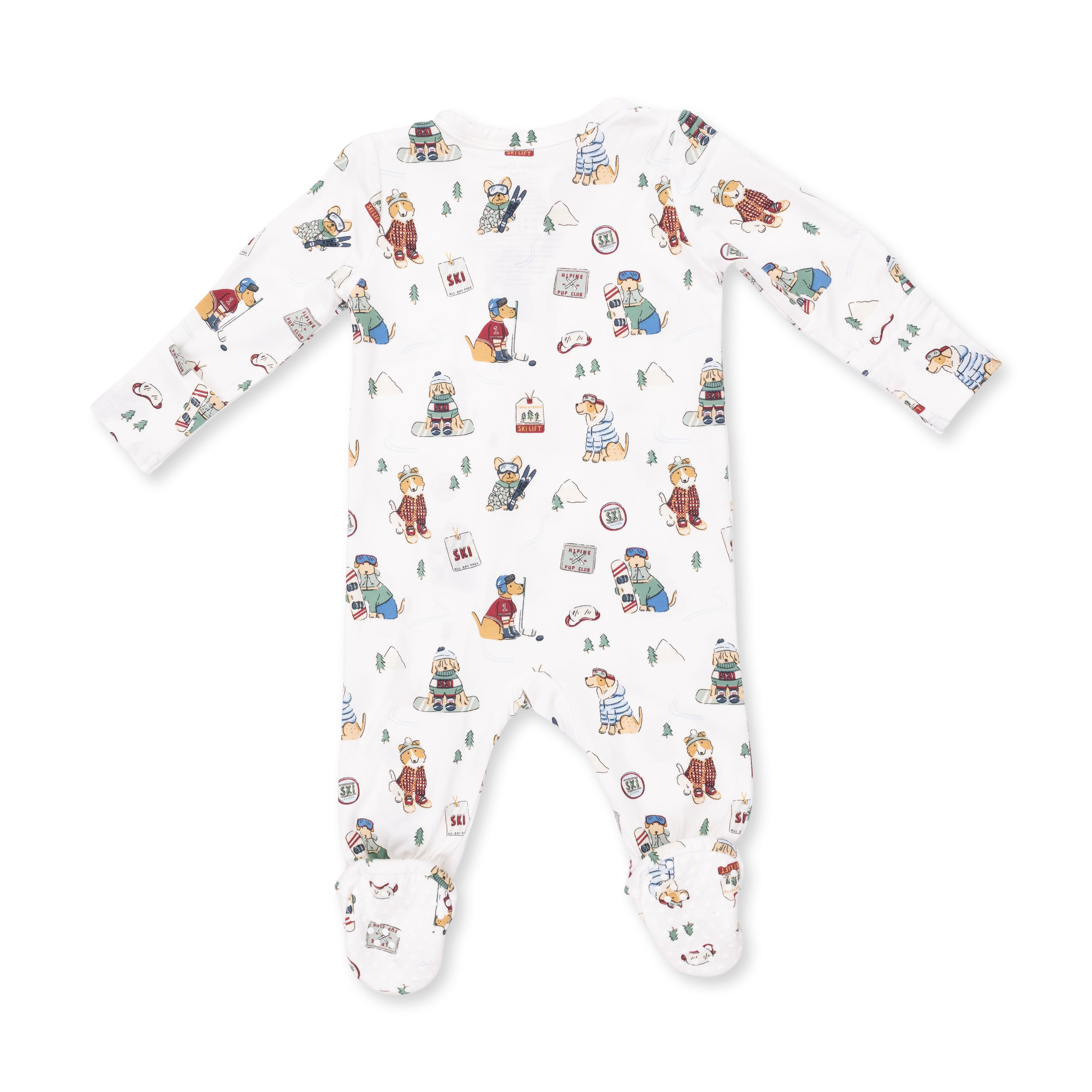 A white long-sleeve baby footed sleeper with an all-over whimsical winter-themed print featuring bears, snow globes, and small illustrations, shown flat on a white background.