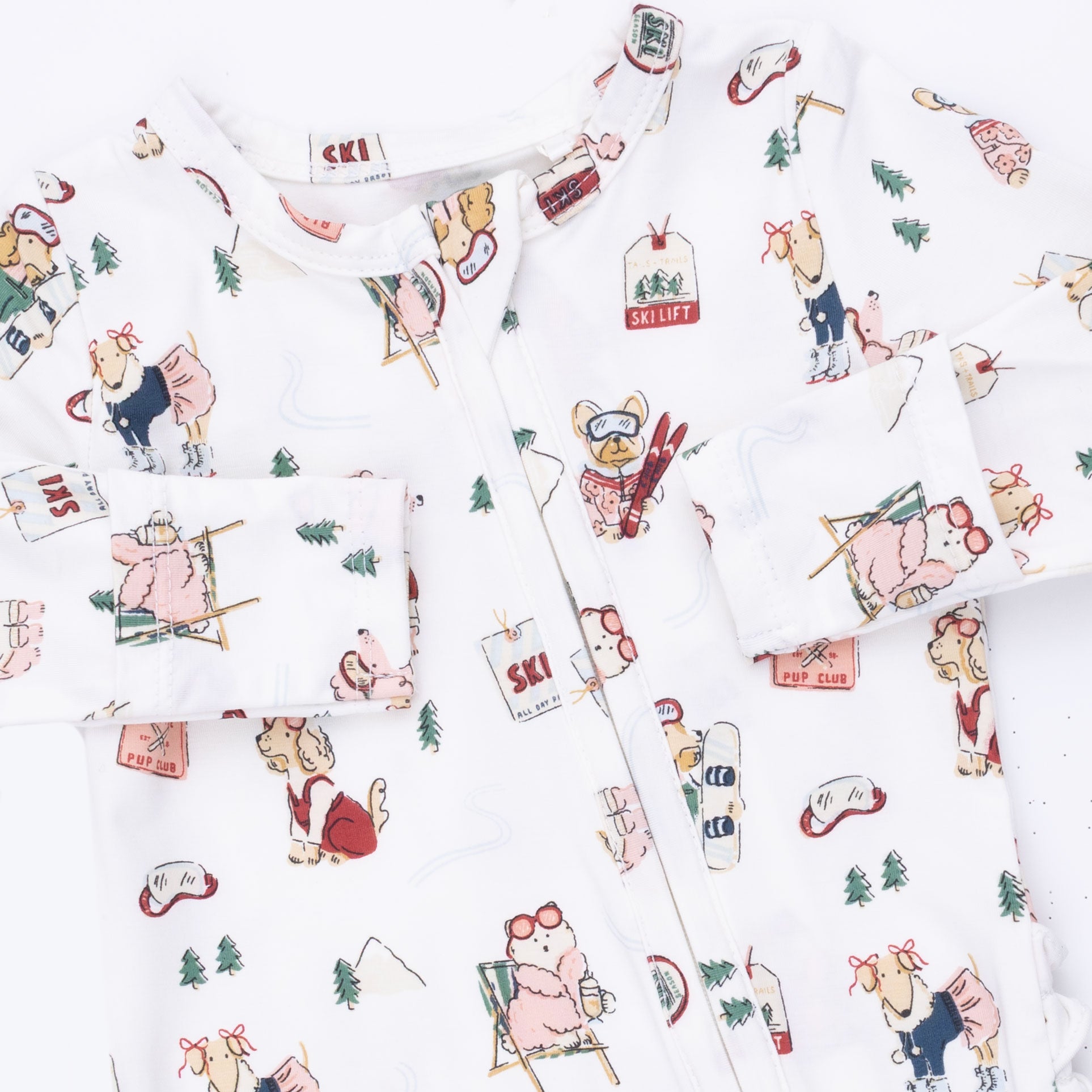 Patterned fabric with dogs and skiing equipment on a white background