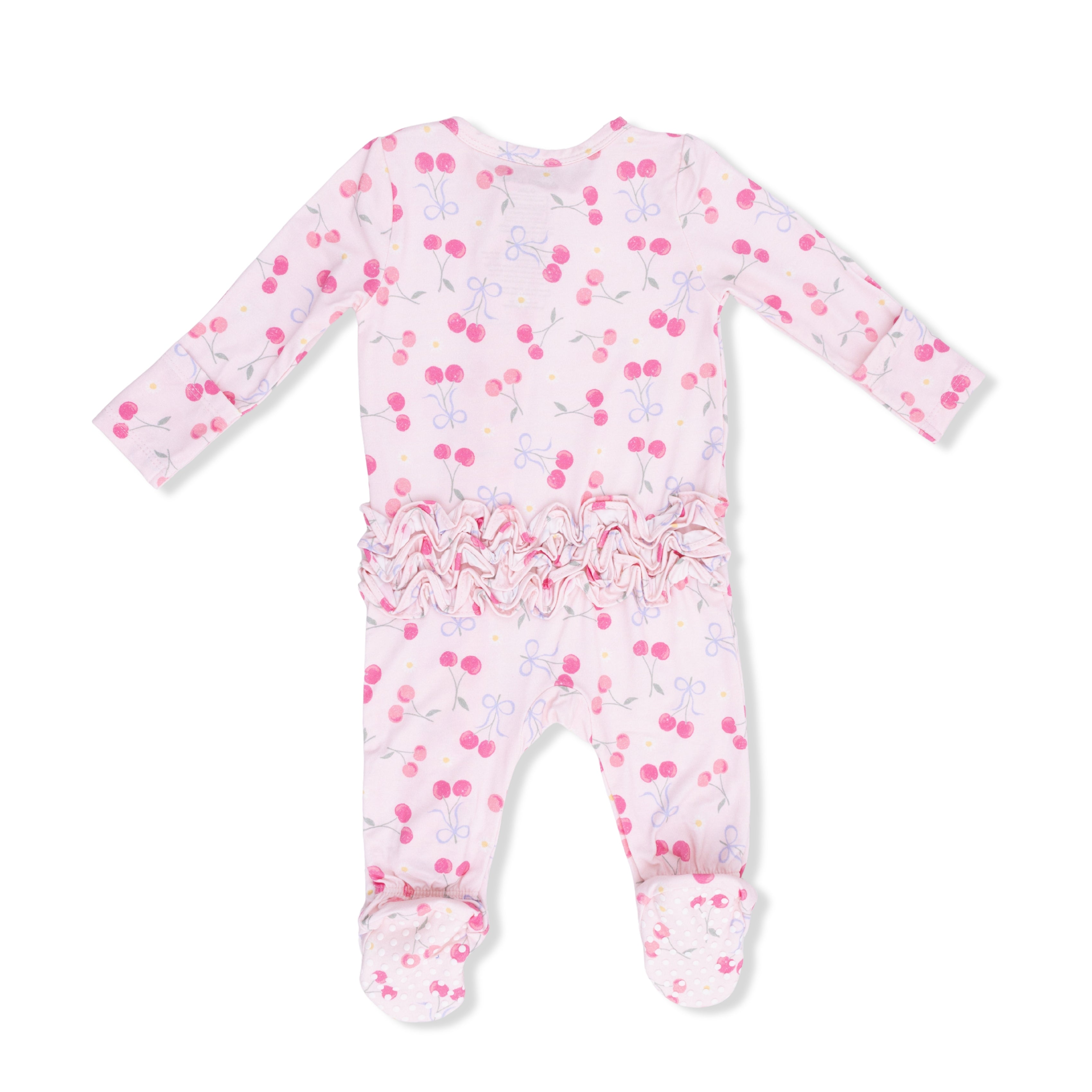 Baby footie with cherry pattern on a white background