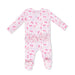 Baby footie with cherry pattern on a white background