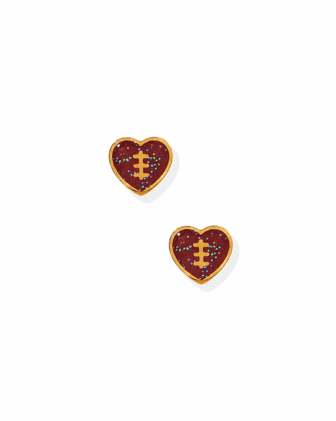 Pair of gold football heart earrings on a white background