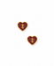 Pair of gold football heart earrings on a white background