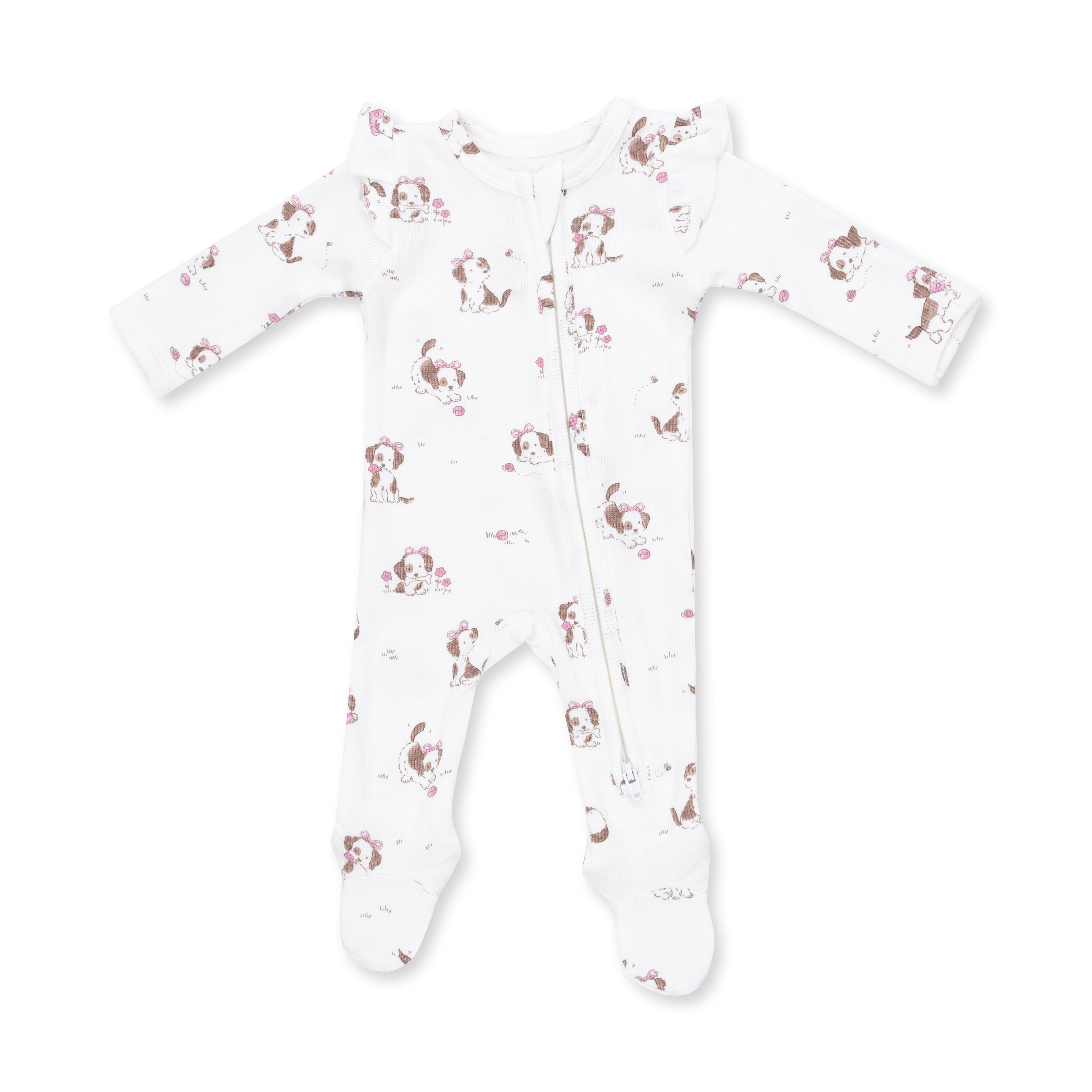 A white long-sleeve footed sleeper with a front zipper and an all-over print of brown and pink cartoon dogs, shown on a plain white background.