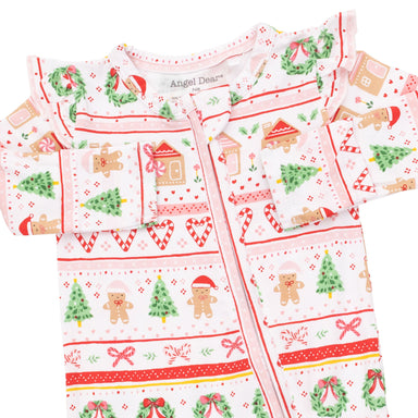 A baby long-sleeve footless onesie with a festive Christmas print, featuring gingerbread men, trees, wreaths, and candy canes on a white background with red and green patterns. The brand name 'Angel Dear' is visible on the inner neck label.