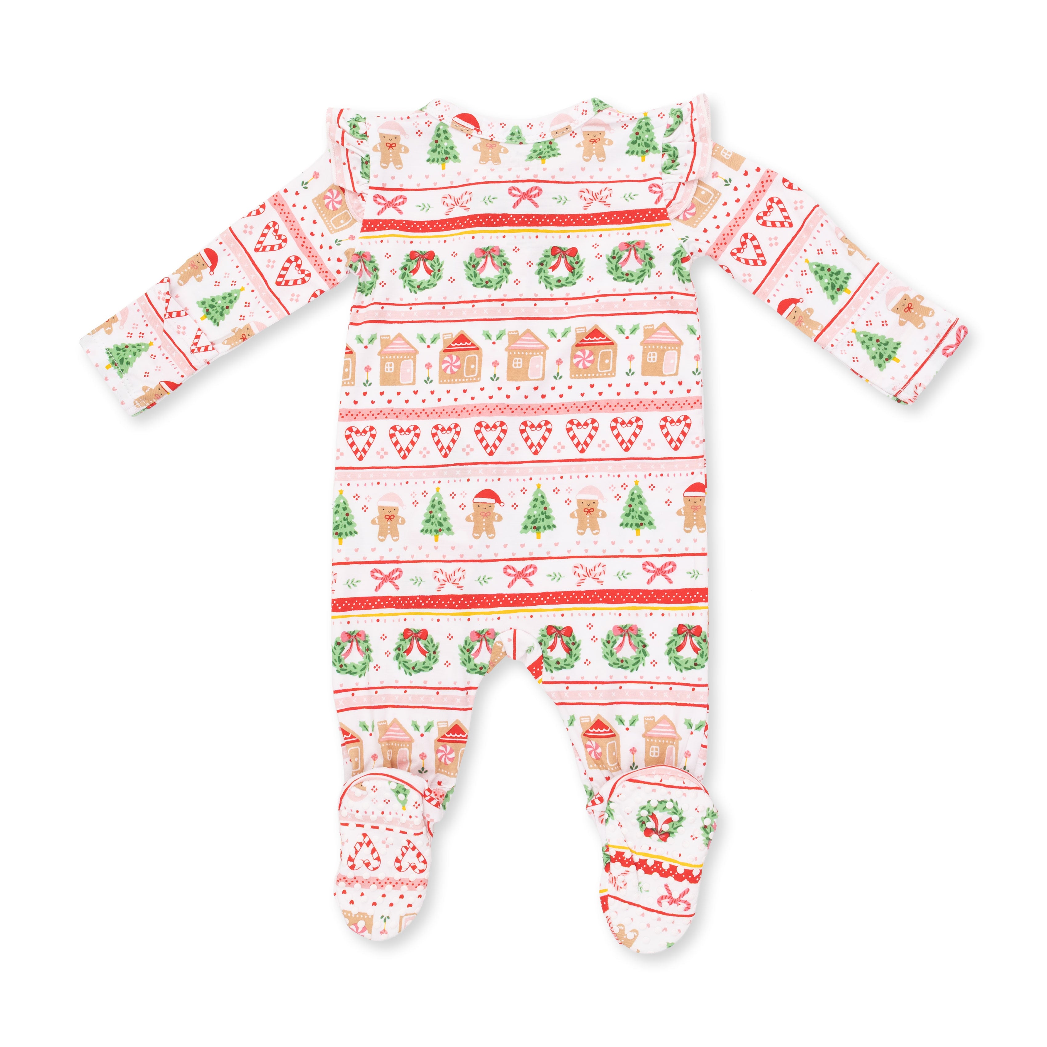 A baby footed one-piece sleeper with long sleeves, featuring a festive Christmas Fair Isle pattern with gingerbread houses, trees, wreaths, candy canes, and bows on a white background.