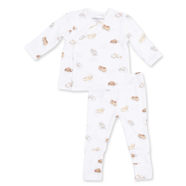 White baby set with puppy pattern on a white background