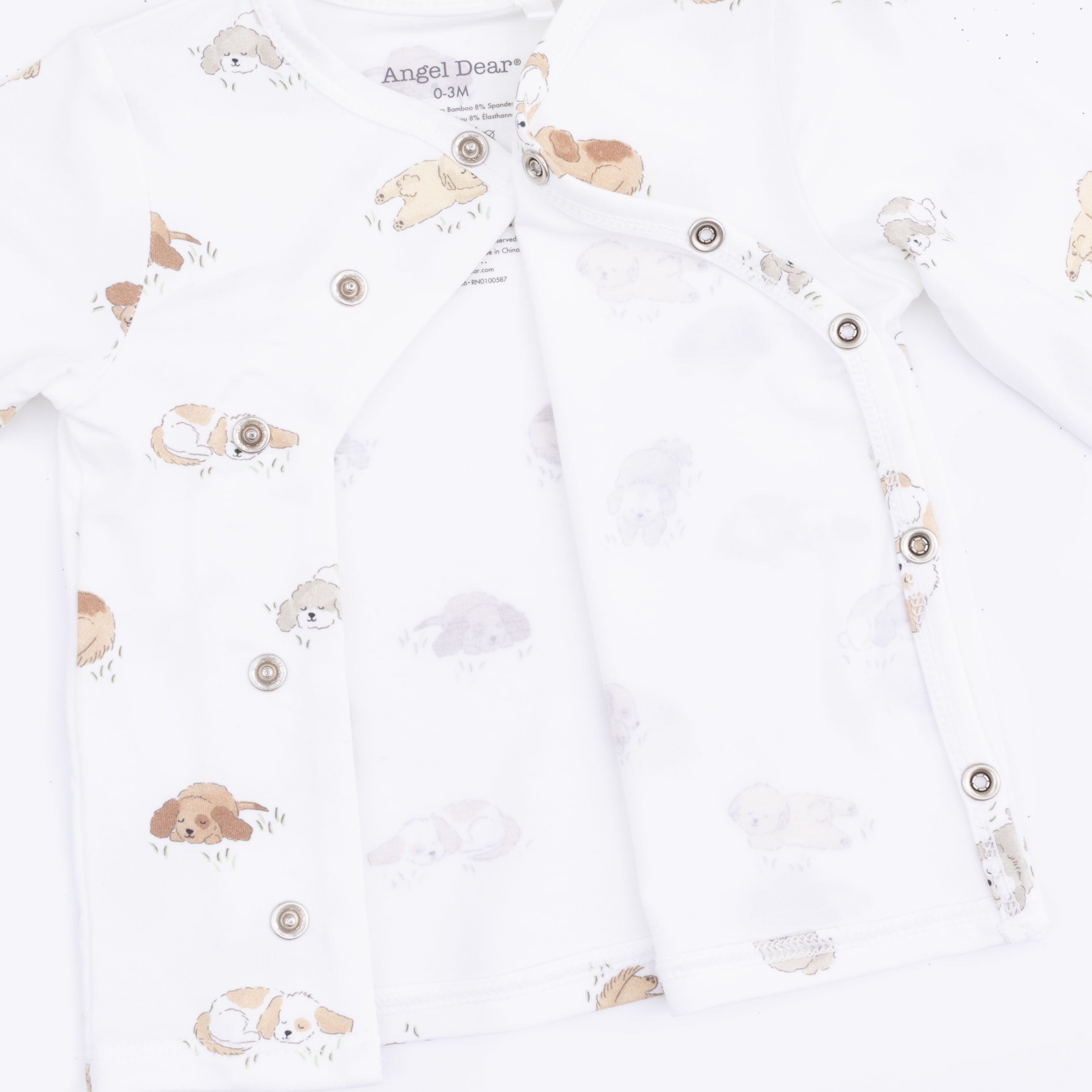 Baby romper with puppy prints on a white background
