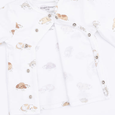 Baby romper with puppy prints on a white background