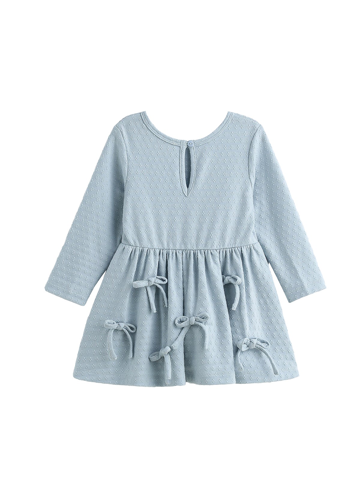 A light blue long-sleeve baby dress with a textured waffle pattern, a keyhole neckline, and decorative tie bows on the skirt, shown against a plain white background.