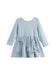 A light blue long-sleeve baby dress with a textured waffle fabric, featuring a gathered waist and four matching fabric bow details on the skirt, shown against a plain white background.