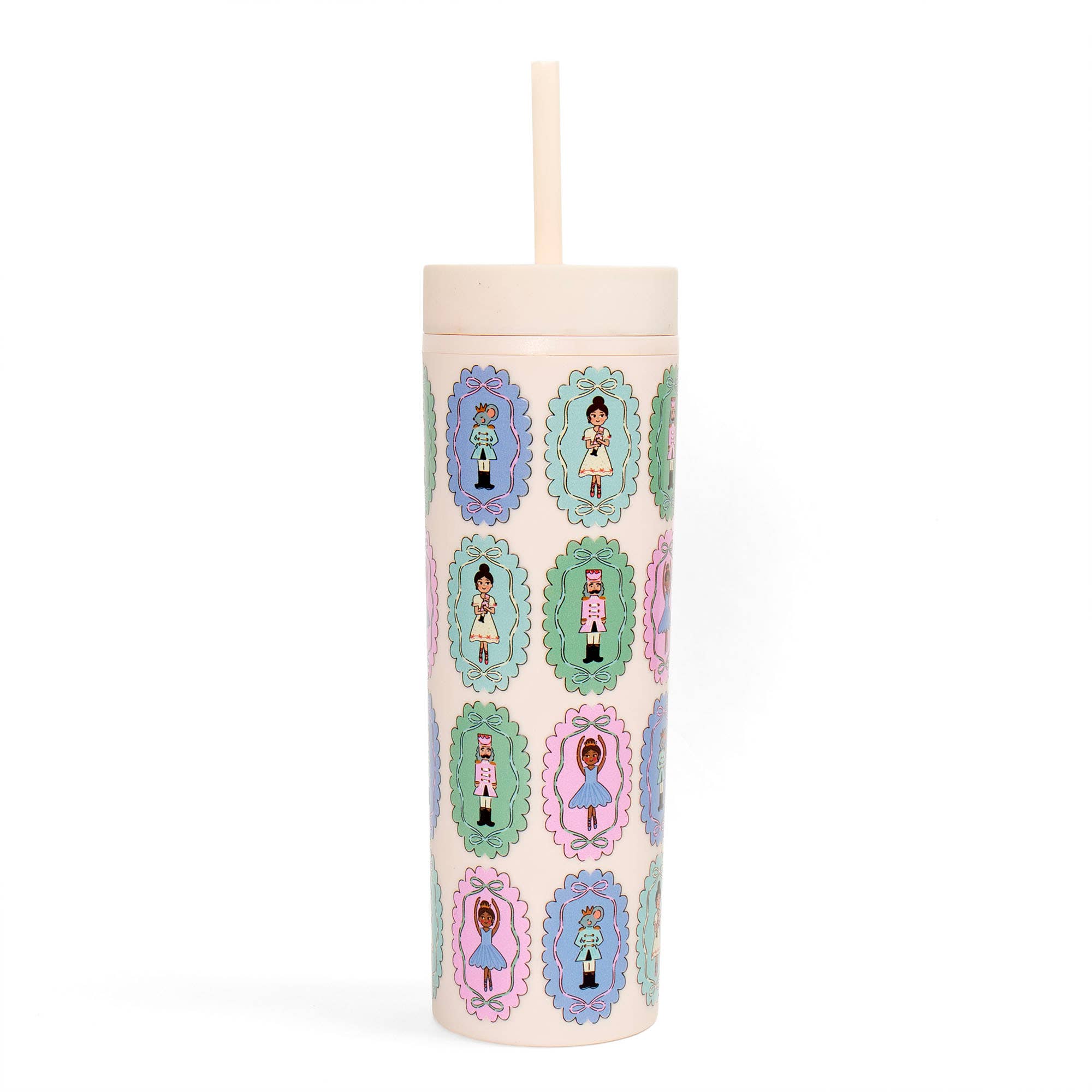 Nutcracker Christmas acrylic tumbler with straw featuring colorful ballerinas and toy soldiers in decorative pastel frames by Pippi Post