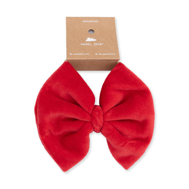 Red bow hair accessory on a white background with 'Angel Dear' packaging.