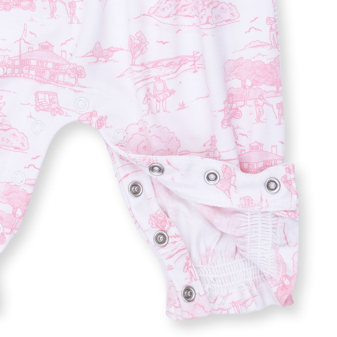 Baby romper with pink and white toile pattern on a white background