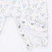 Floral-patterned fabric with snaps on a white background