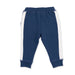 A pair of navy blue sweatpants for toddlers, featuring white side stripes and ribbed cuffs, shown flat on a white background.