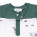 Green and white baby romper with dog and duck pattern on a white background