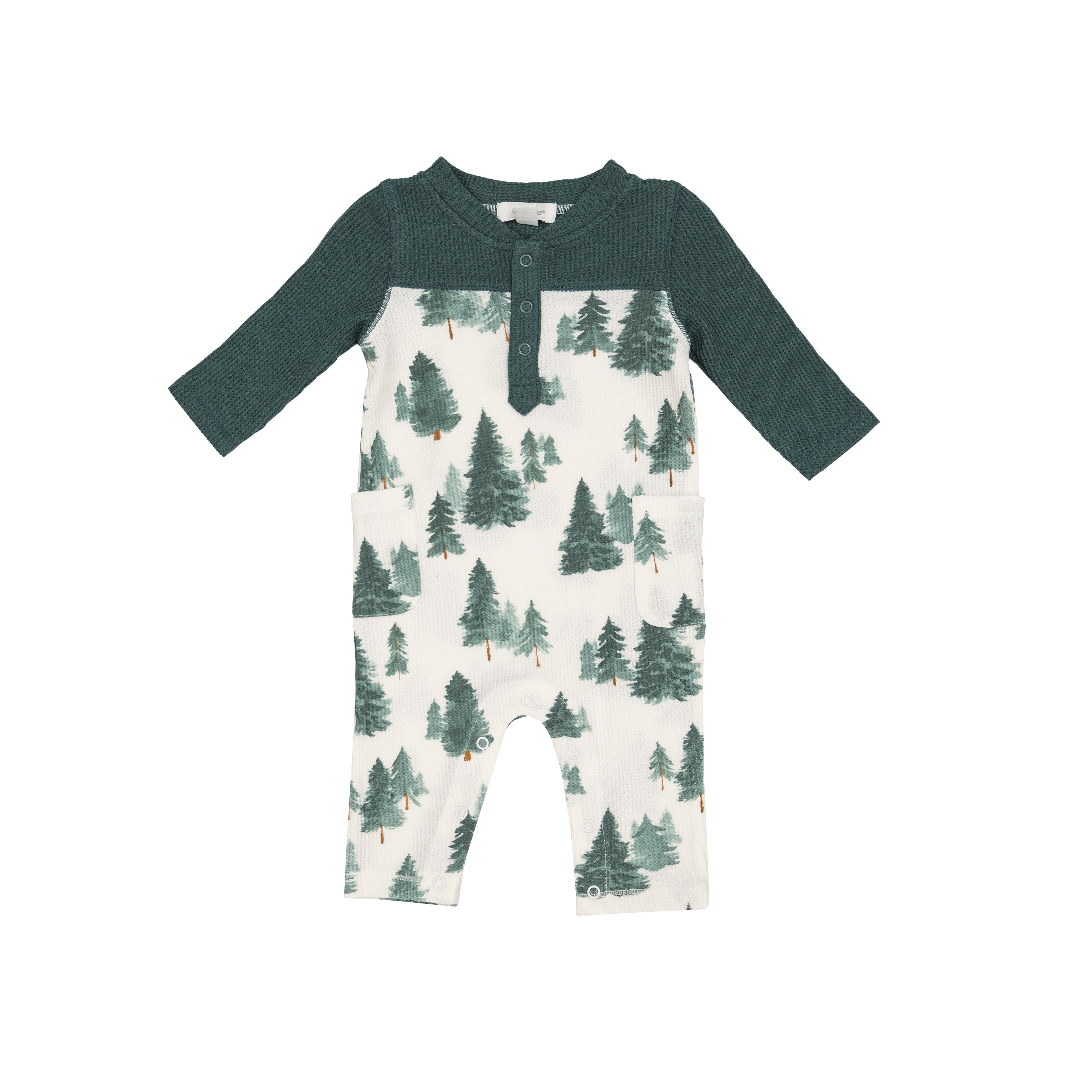 White romper with a forest tree print and a forest green collar & sleeves