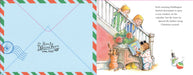 A children's book or booklet spread showing illustrated Christmas-themed scenes: a blue envelope with postage-style markings on the left, and two illustrated children and a teddy bear by a staircase on the right, with text beside them.