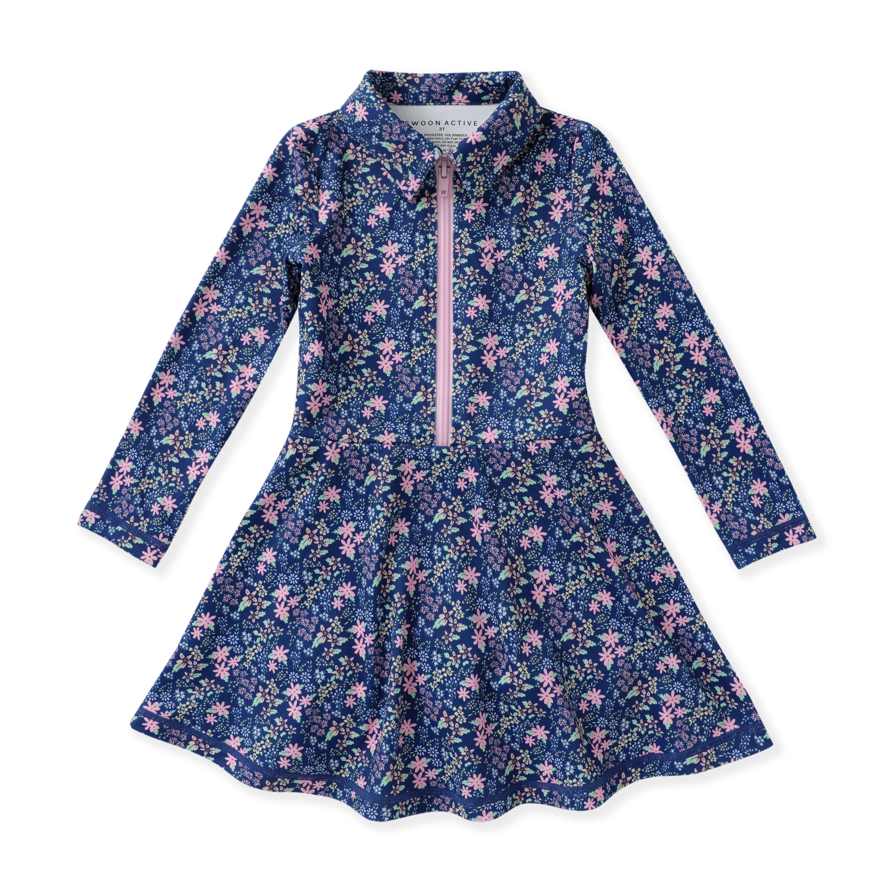 A girls' long-sleeve tennis dress with a navy blue floral print, featuring a pink zipper at the collar and a flared skirt, shown flat on a white background.
