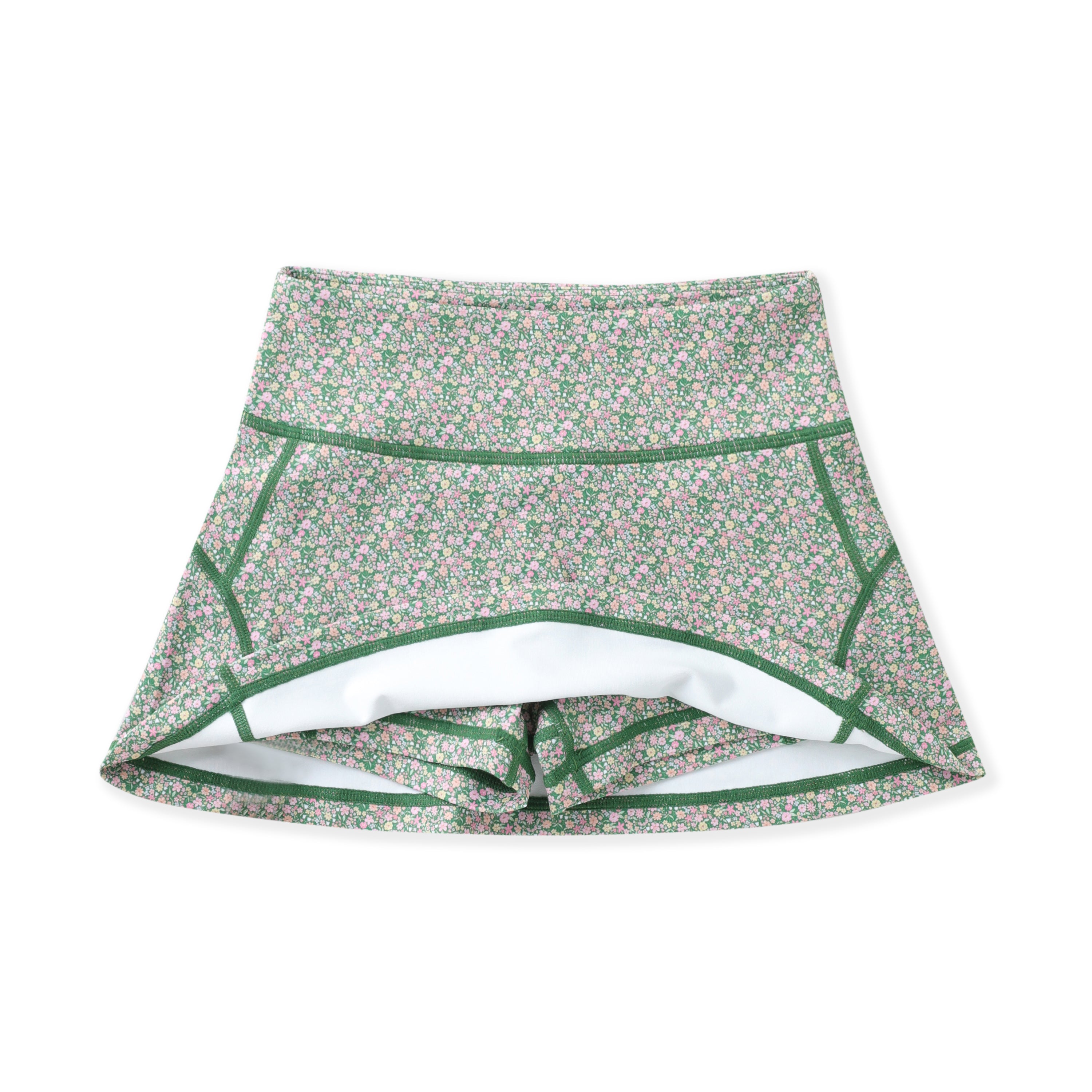 A pair of high-waisted athletic shorts featuring a green and pink floral pattern, green contrast stitching, and a white interior lining, shown against a plain white background.