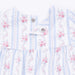 Floral patterned romper with snaps on a white background