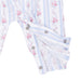 Close-up of a baby garment with a white base, light blue vertical stripes, and a pink floral print. The fabric shows snap-button closures and an elasticized ruffled hem.