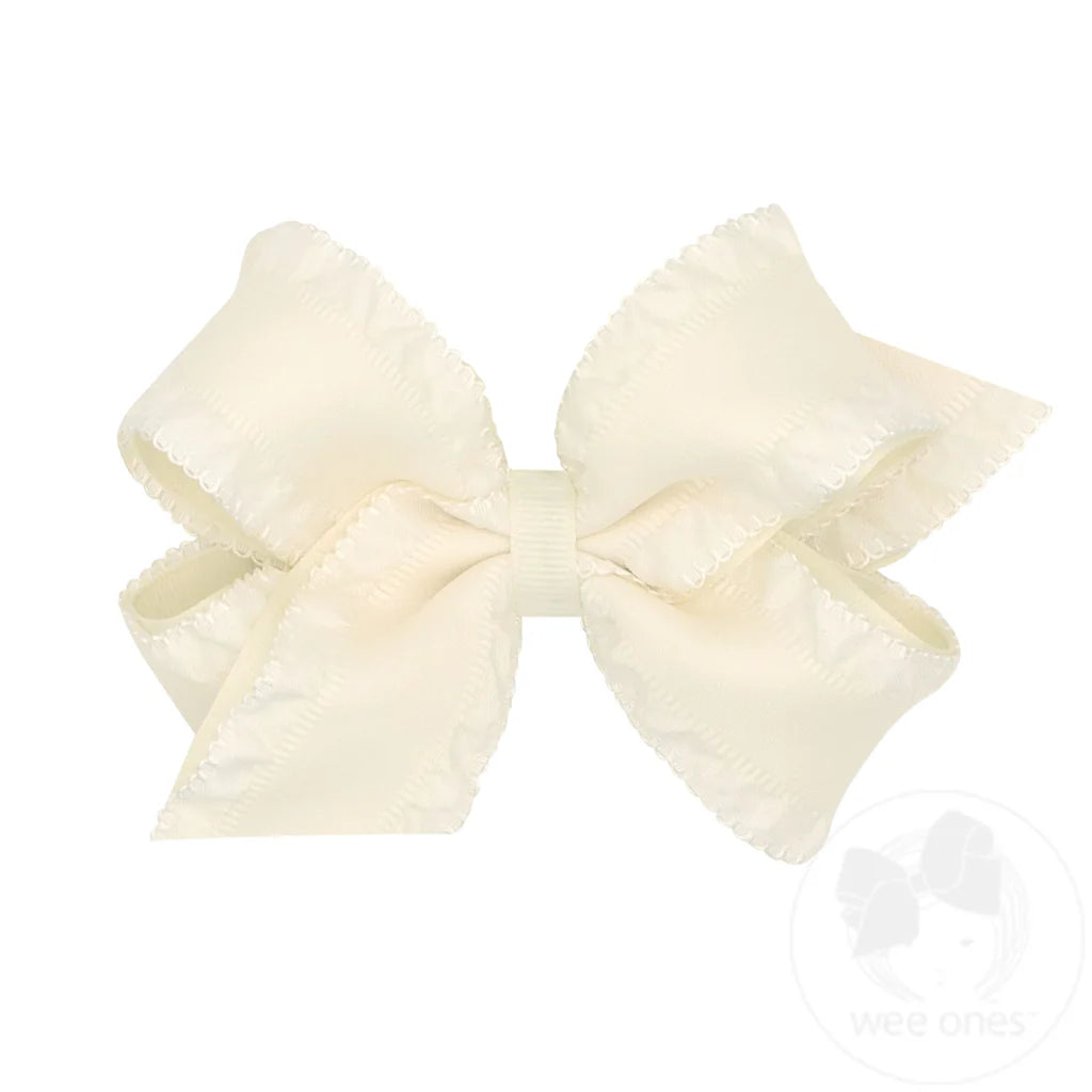 Large cream-colored bow on a white background