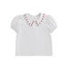 White blouse with red apple embellishments on a white background