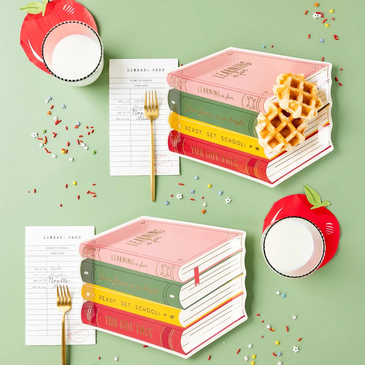 Apple shaped napkins with books and a fork