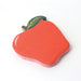 Red apple-shaped notepad with a green leaf on a white background