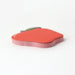 Red apple-shaped object on a white background