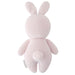Knitted pink bunny toy on a white background