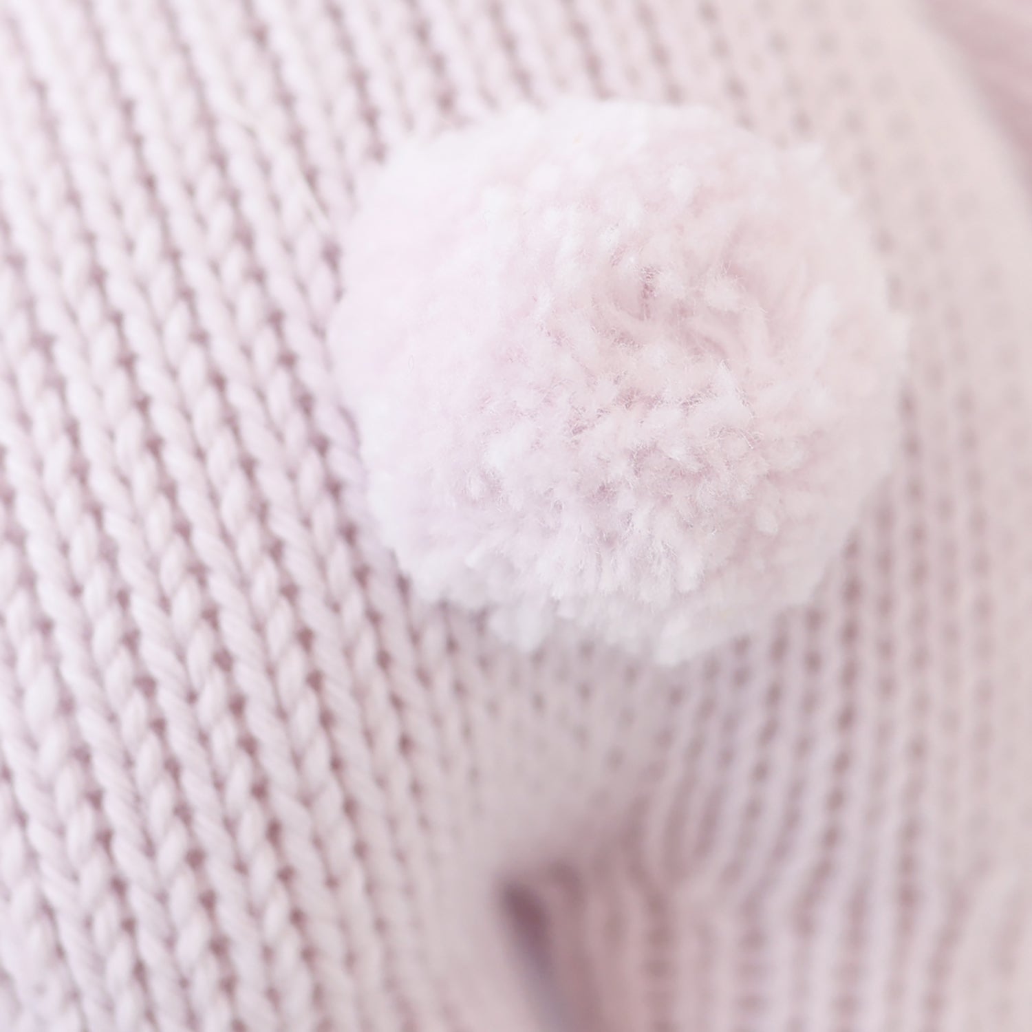 Close-up of pink yarn with a textured pattern