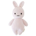 Knitted rabbit plush toy on a white background