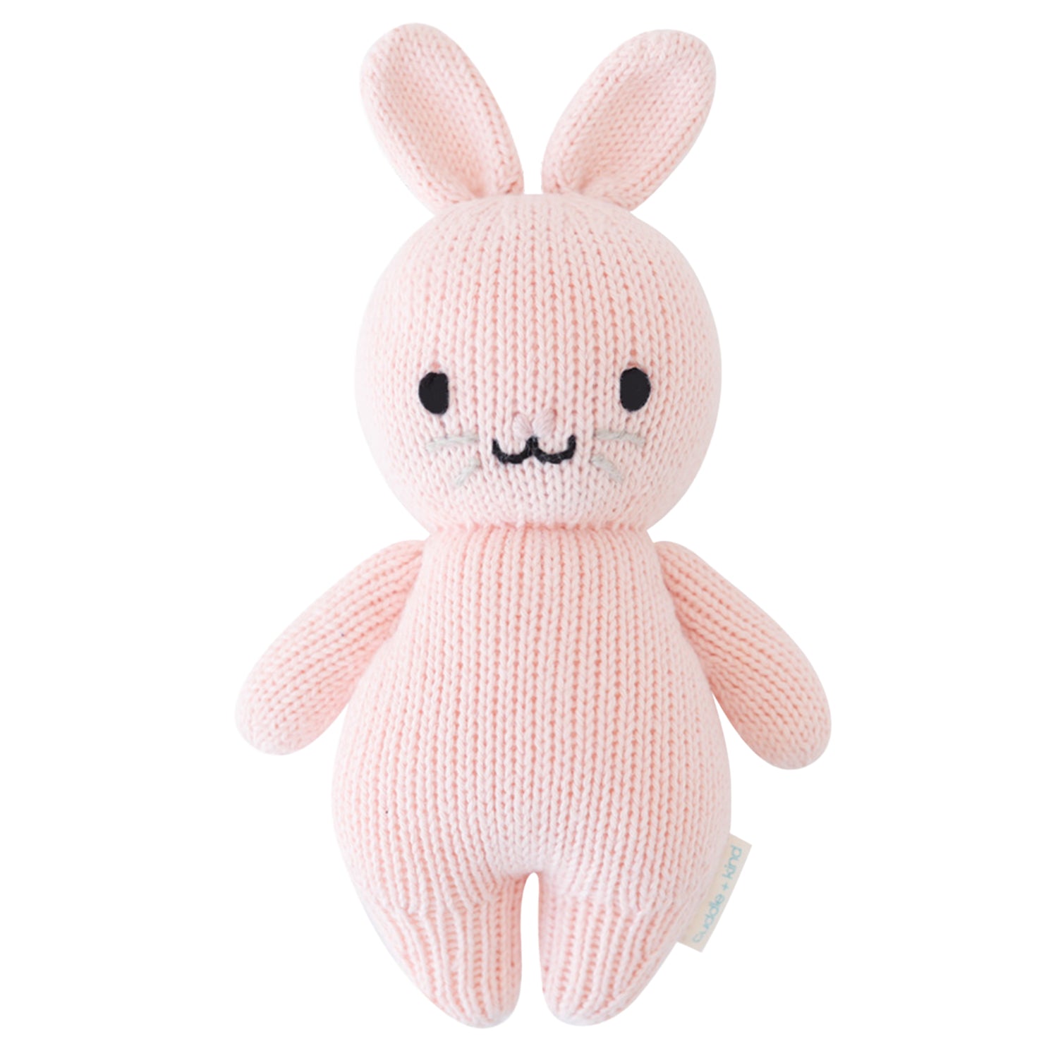 Knitted pink bunny toy on a white background