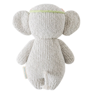 Knitted gray monkey toy on a white background