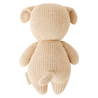 Knitted beige teddy bear on a white background