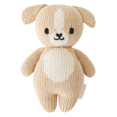Knitted dog toy with a white belly on a white background